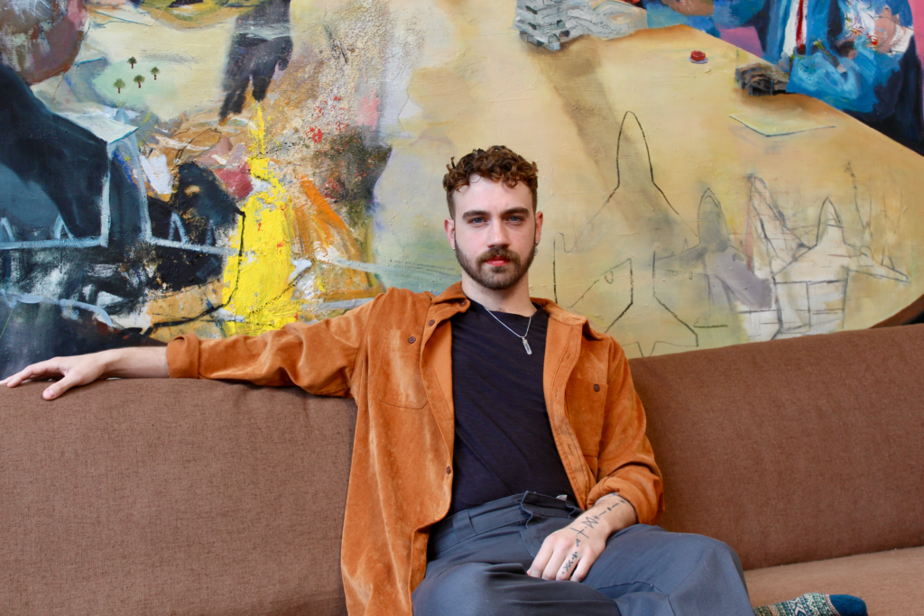 Lucas Beecham sitting on a couch
