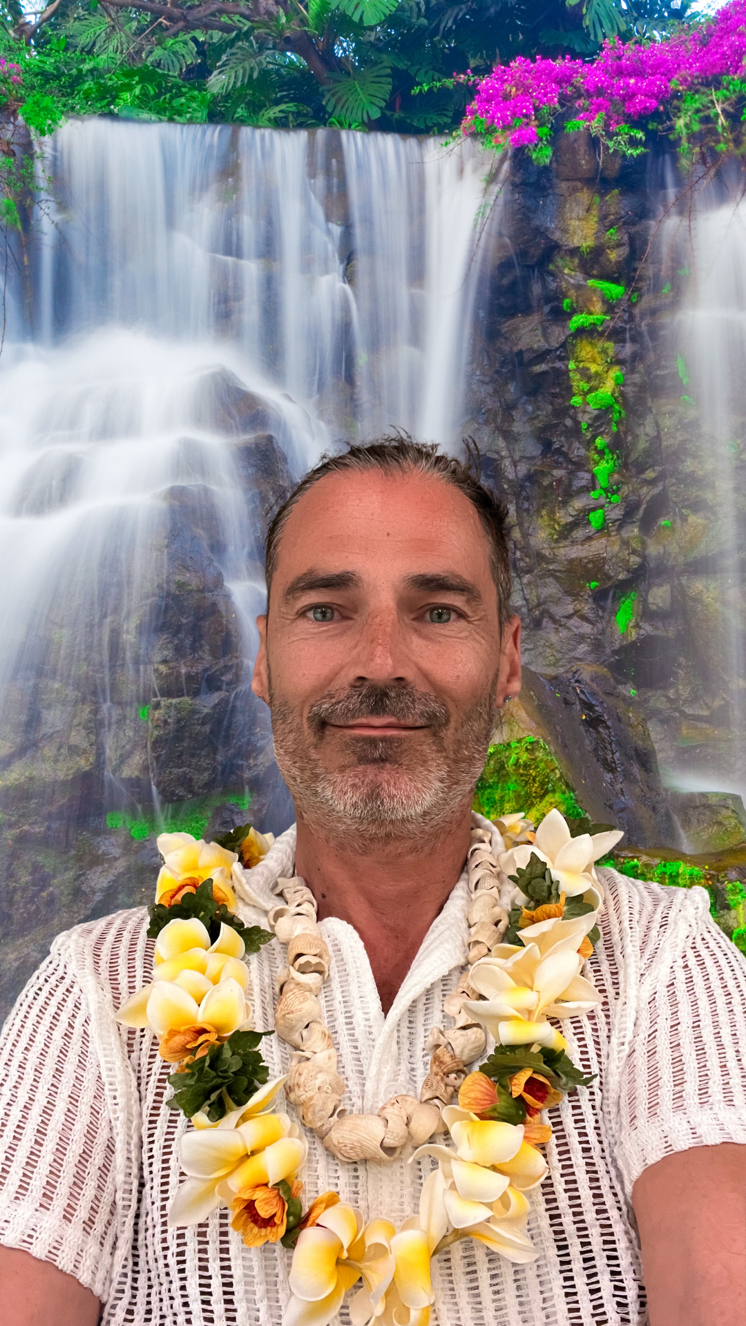 Victor Leonard in front of beautiful waterfall